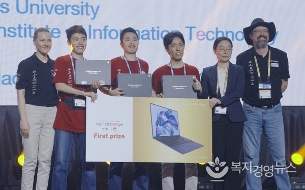 The Tokyo trio celebrating victory in the ICPC Challenge